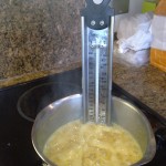 Fudge in the pan, with the sugar thermometer